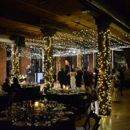 Twinkle Lights hanging as a Canopy between the center columns at The Dumbo Loft.  Also, Twinkle Lights wrapping around the center columns at The Dumbo Loft.