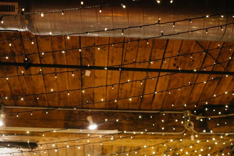 A canopy of Twinkle Lights hanging between center columns at The Dumbo Loft.