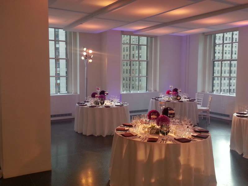Setup lavender wireless LED Up-Lights around the inside perimeter walls for a wedding at 620 Loft and Garden. Also, set up pin spots on the table centerpieces for a wedding at 620 Loft & Garden.