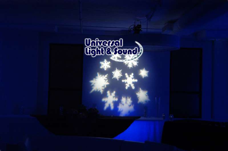 A set of snowflake gobo projections on the walls at The Beer Garden at Studio Square NYC. Also, blue Up-Lights were setup along the walls to create a Winter Wonderland for a Corporate Party Holiday Party.