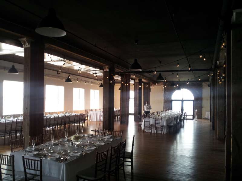 Universal Light and Sound setup string lights (Bistro Lights) over the dance floor for a beautiful summer wedding at The Liberty Warehouse.
