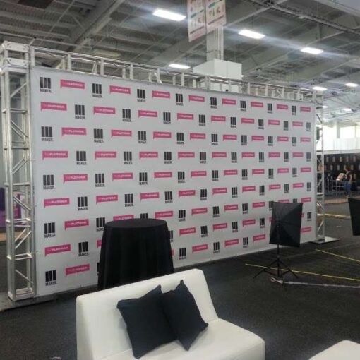 Setup a 20ft wide x 10ft height truss structure to support a Step-and-Repeat banner for a booth at BeautyCon NYC.