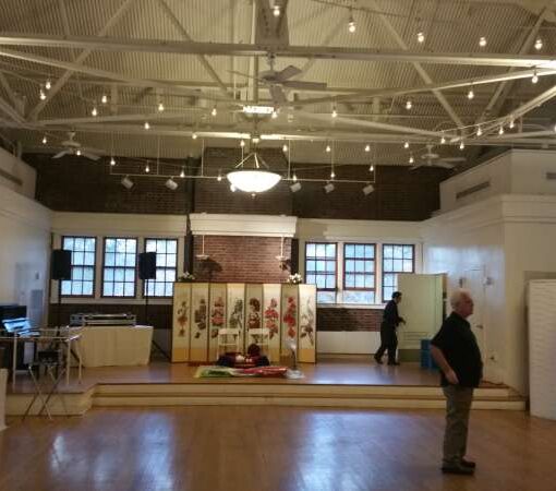 String Lights hanging in a Zigzagging pattern over the majority of the main room inside The Prospect Park Picnic House.