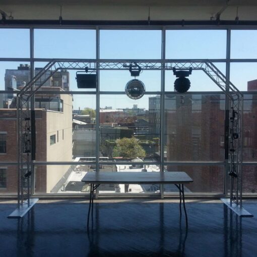 An arched Lighting Truss with a rotating 16" Mirror Ball and various dance floor lighting effects at The W-Loft.