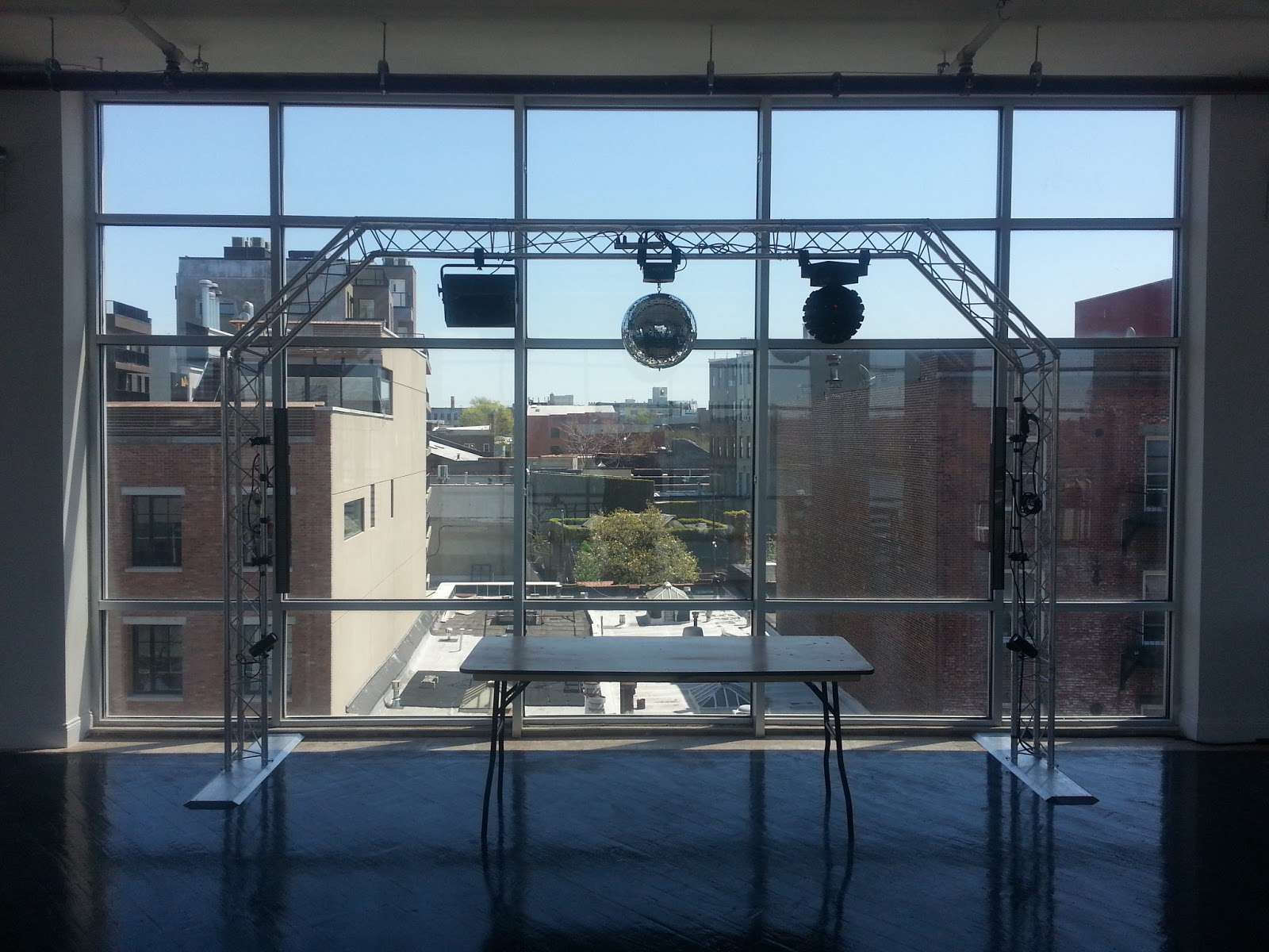 An arched Lighting Truss with a rotating 16" Mirror Ball and various dance floor lighting effects at The W-Loft.