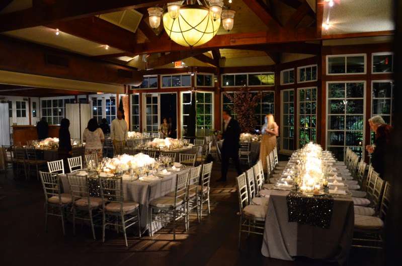 Pin-Spots are highlighting the floral arrangements at each table at The Central Park Loeb Boathouse.