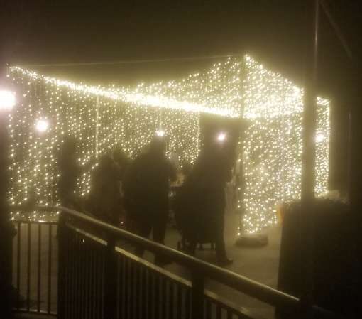 A Tunnel of LED Lights hanging above the dinner table for a micro wedding at The Clubhouse of Lake Success.