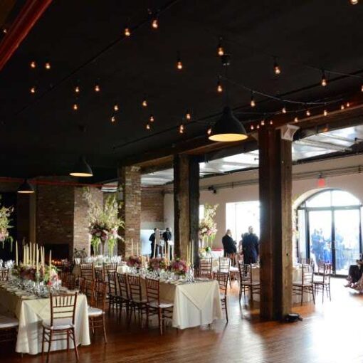 Cafe Light (String Lights/ Bistro Lights) hanging over the dance floor in The Harbor Room at the Liberty Warehouse.