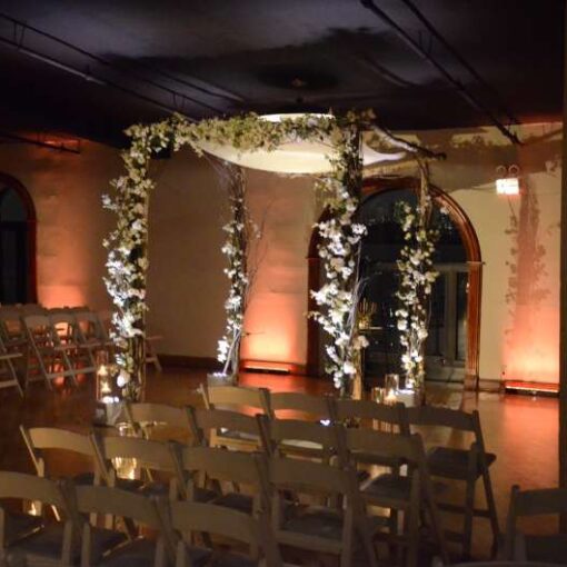 A spotlight on the ceremony area. Finally, Up-Lights at the base of the chuppah.