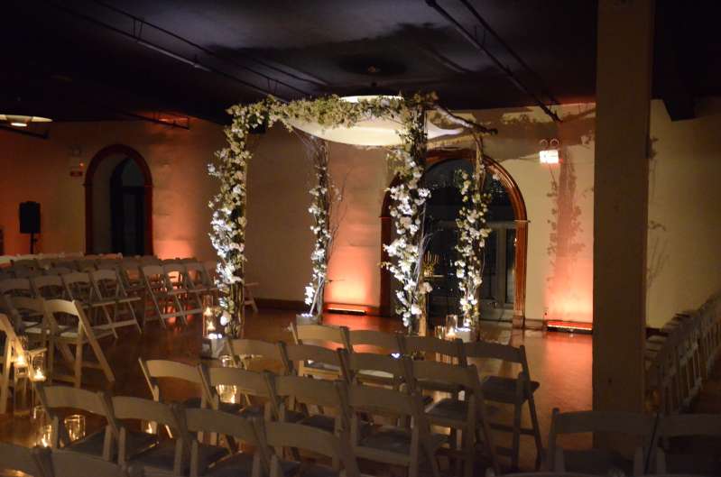 A spotlight on the ceremony area. Finally, Up-Lights at the base of the chuppah.