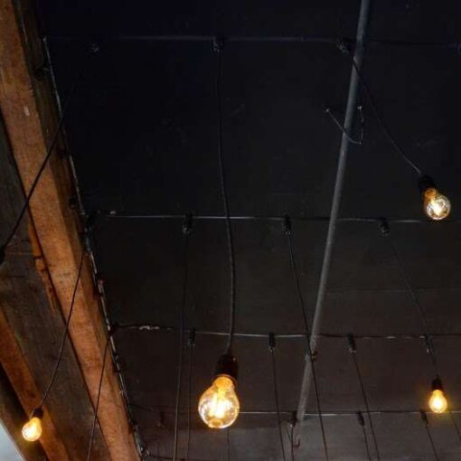 Pendant lamps with vintage/antique style Edison Bulbs hanging over the dance dance floor at The Liberty Warehouse