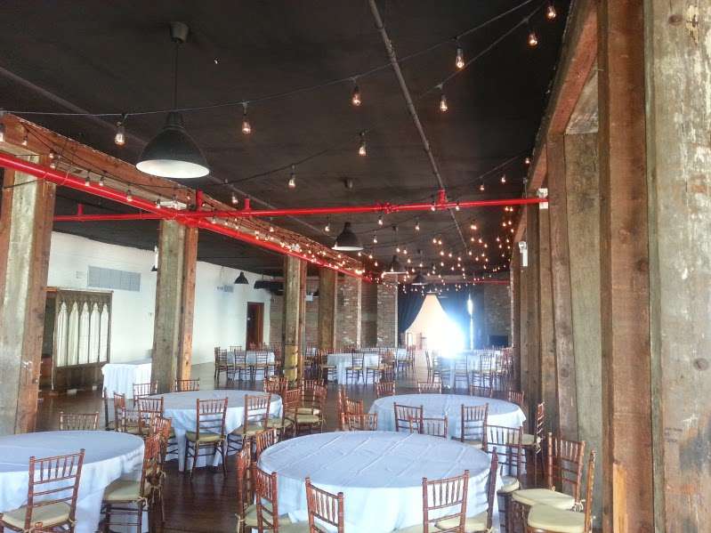 Bistro Lights hanging above the full length of the reception room between the center columns at The Liberty Warehouse.