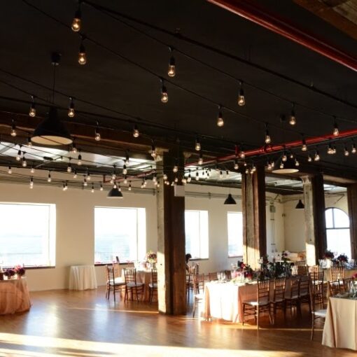 String Lights hanging in a zigzag pattern over the dance floor in The Harbor Room at The Liberty Warehouse.