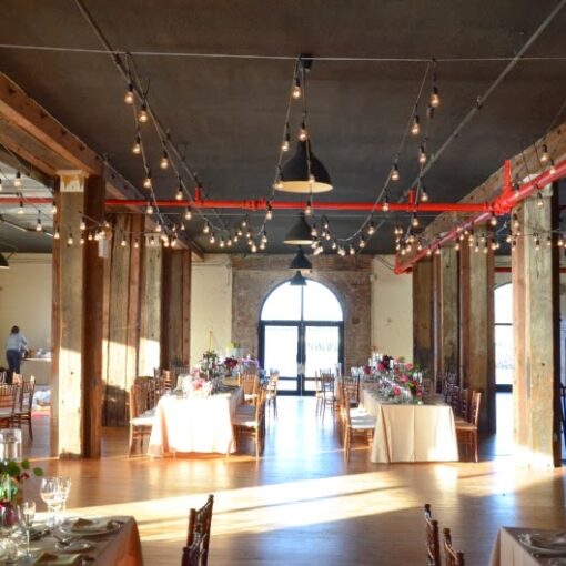 String Lights hanging in a zigzag pattern over the dance floor in The Harbor Room at The Liberty Warehouse.