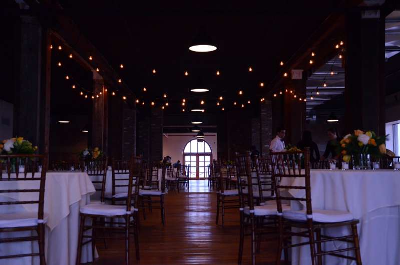 String Lights hanging above the dance floor for a wedding reception in the Harbor Room at The Liberty Warehouse.
