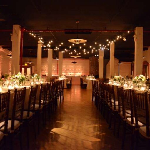String lights are hanging above the dance floor in the Governor's Room on the 2nd floor at The Liberty Warehouse. Also, Table Pin-spots for the centerpiece at each table and both bars at each end of the room. In addition, Up-Lights along the perimeter walls.