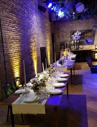 Pin-spots were suspended overhead and focused on table centerpieces with up-lights along the perimeter walls at The Wythe Hotel.. Also, a color-changing sound-activated wash to illuminate the dance floor.