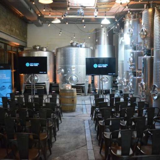A pair of 60" Flat Screen TVs showing the same image for a corporate event at The Brooklyn Winery. Also a wireless microphones, Up-lights and String Lights for a corporate event hosted at The Brooklyn Winery.