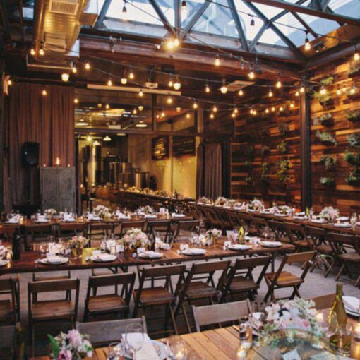 150ft of String Lights hanging in a zigzagging pattern overhead for a wedding in The Atrium at The Brooklyn Winery.