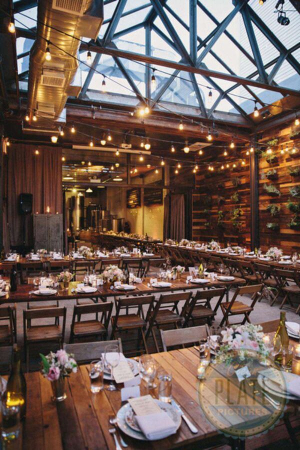 150ft of String Lights hanging in a zigzagging pattern overhead for a wedding in The Atrium at The Brooklyn Winery.