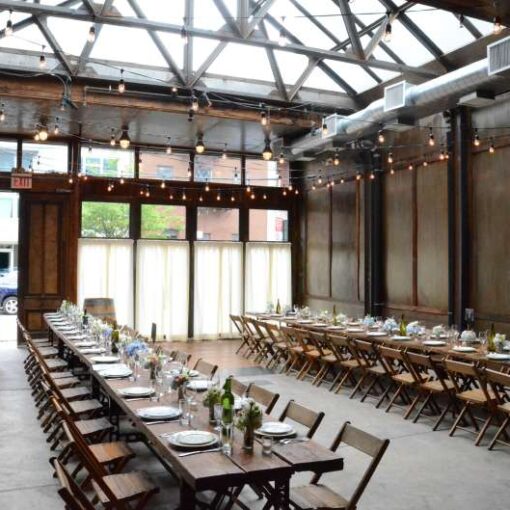 150ft of String Lights hanging overhead in a zigzagging pattern for a wedding in The Atrium at The Brooklyn Winery.