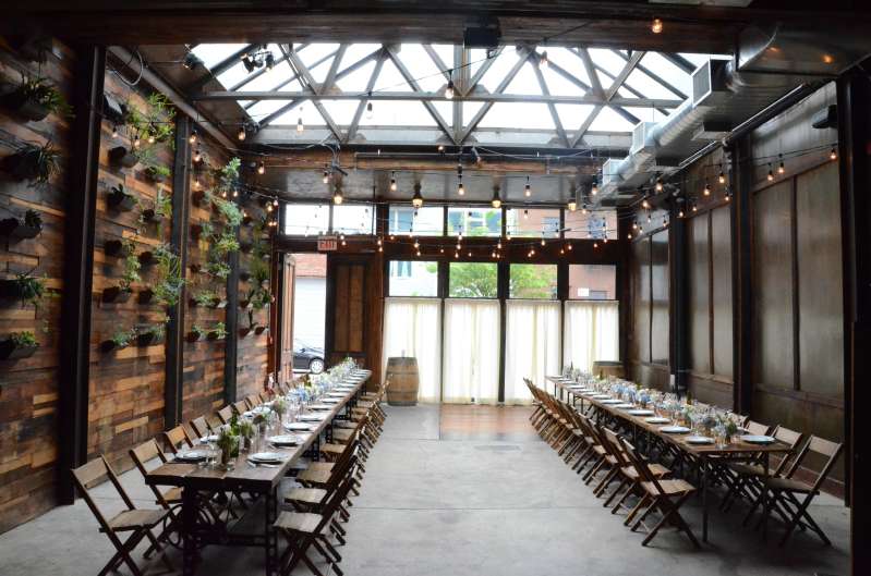 150ft of String Lights hanging overhead in a zigzagging pattern for a wedding in The Atrium at The Brooklyn Winery.