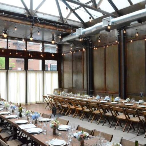 150ft of String Lights hanging overhead in a zigzagging pattern for a wedding in The Atrium at The Brooklyn Winery.