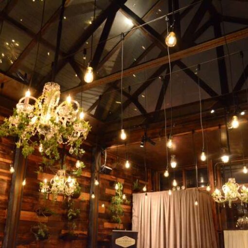 Pendant Lamps along with Chrystal Chandeliers hanging overhead in the Atrium at The Brooklyn Winery.