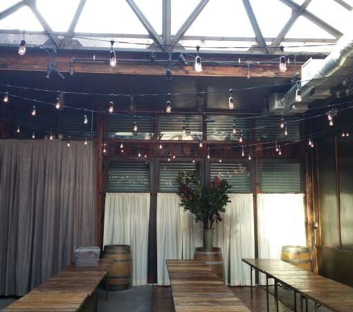 150ft of String Lights in a zigzagging pattern hanging overhead for a wedding in The Atrium at The Brooklyn Winery.