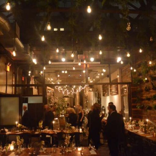 String Lights hanging in The Harvest Room along with Pendant Lamps hanging in The Atrium at The Brooklyn winery.