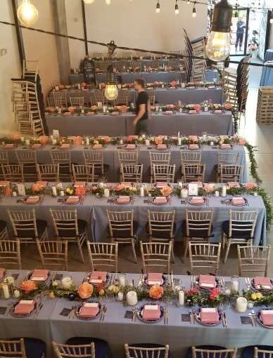 String Lights hanging above the main room and vertically as a backdrop against wall for a wedding at Dobbin St.
