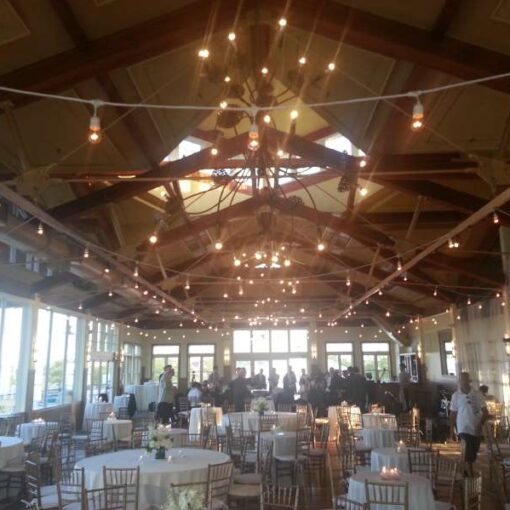 String lights hanging in parallel lines overhead in the Grand Ballroom at the Liberty House Restaurant in Jersey City, NJ.