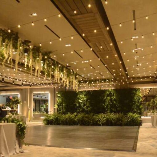 String Lights hanging in multiple parallel lines over the dance floor at The 1 Hotel Brooklyn Bridge located in Brooklyn, NY.
