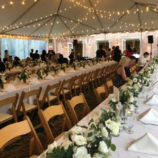 String Lights w/ G50 bulbs hanging in a randomly zigzagging pattern under a 60ft x 40ft Tent for a wedding reception in Alpine, NJ.
