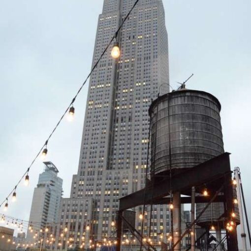 String Lights hanging from lighting stands in a V-Shaped pattern above the rooftop of Gary's Loft in midtown Manhattan, NYC.