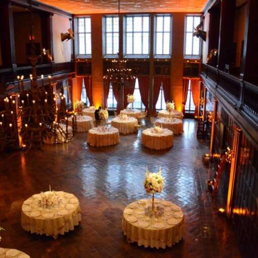 Pin-Spots on all floral centerpieces on each table with Up-Lights along the perimeter of the reception room at The Harvard Club in New York City.