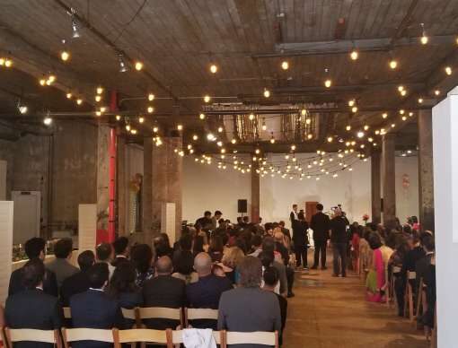String Lights overhead for a wedding at The Invisible Dog Art Center in Brooklyn, New York.