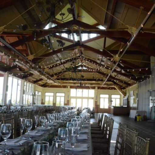 String Lights with round G50 bulbs hanging in a circular/Star-shaped pattern over the majority of the 2nd-floor ballroom at The Liberty House Restaurant located in Jersey City, NJ.