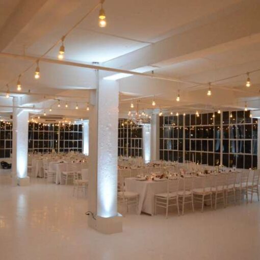 String Lights hanging above the majority of the main room at Studio 450 with Up-Lights and intelligent lights for the dance floor.