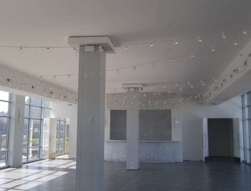 String Lights hanging in a zigzag pattern inside the main reception room at The W-Loft in Brooklyn, NY.
