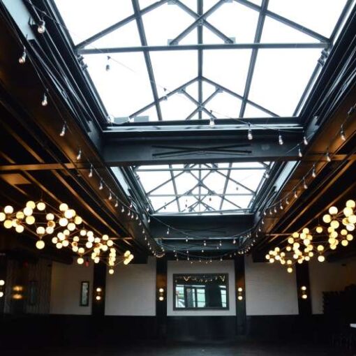 String lights hang under the skylight in the main reception room at 501 Union, which is located in Brooklyn, New York.