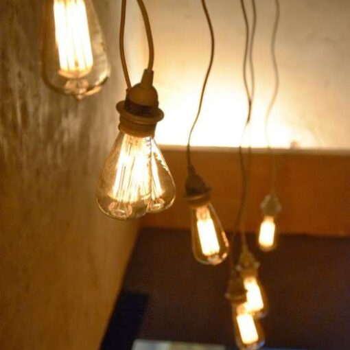 Pendant Lamp w/ Vintage Edison Light Bulbs hanging above the stairway at 632 on Hudson in New York City.