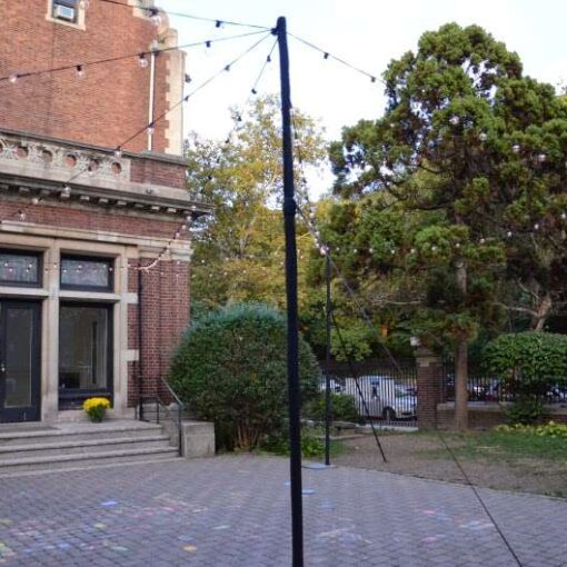 String Lights hanging from lighting stands over the outdoor patio at The Brooklyn Society for Ethical Culture.