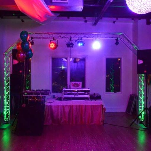 An Arched DJ Truss with multiple LED effects lights for a Graduation Party at The Mansion in Mount Vernon, NY.