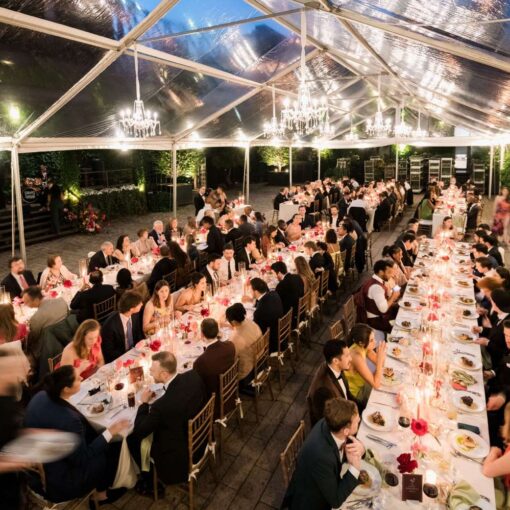 A clear top tent with crystal chandeliers in the courtyard at The Found for Kim & Mert’s wedding - June 1st, 2025