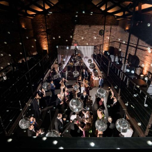 Multiple Mirror Ball hanging in the main reception room at The Found for Kim & Mert’s wedding - June 1st, 2025