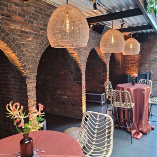Creating a Tropical African-Infused Wedding with Hanging Rattan Lanterns at The Foundry Hanging rattan lanterns, paired with earthy hues and bold tropical florals, helped create a relaxed African-infused wedding at The Foundry.