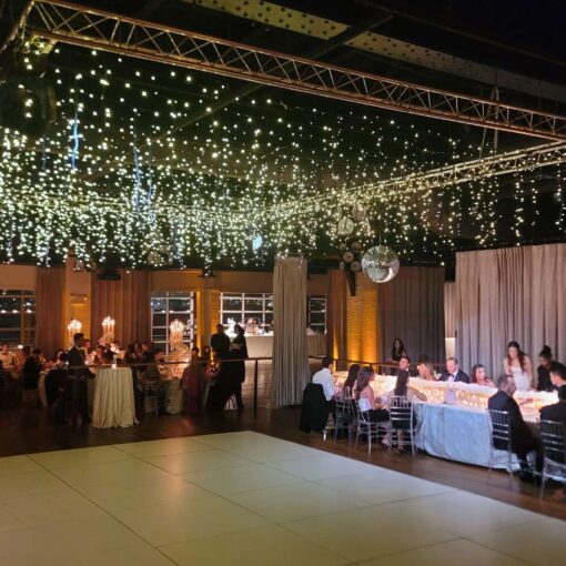 An installation of Fairy Lights and Up-Lights and a mirror ball for Taylor and Troy's elegant wedding at The Lighthouse at Chelsea Piers. An installation of Fairy Lights and Up-Lights and a mirror ball for Taylor and Troy's elegant wedding at The Lighthouse at Chelsea Piers.