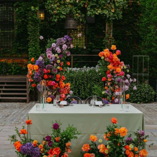 String lights above the head table at an outdoor NYC wedding