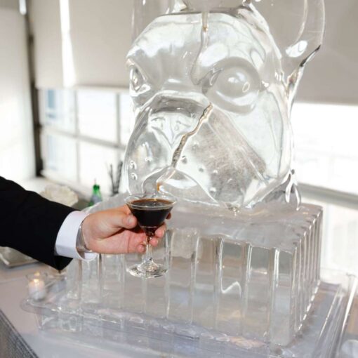 An ice sculpture at Taylor and Troy's elegant wedding at The Lighthouse at Chelsea Piers. An ice sculpture at Taylor and Troy's elegant wedding at The Lighthouse at Chelsea Piers.
